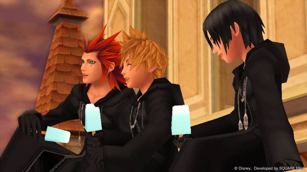 Axel, Roxas e Xion de capa preta tomando sorvete no alto de uma torre, cena de Kingdom Hearts no Switch 2