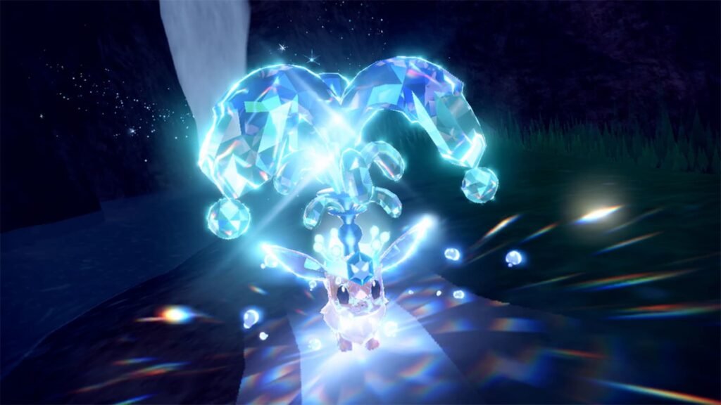 Pokémon brilha sob uma coroa de cristal azul ao Terastalizar, a mecânica de Scarlet e Violet na ordem para jogar Pokémon