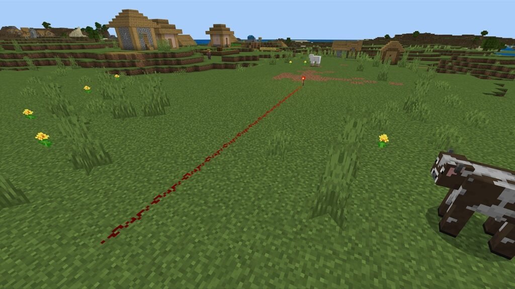 Trilha de pó saindo de uma tocha e escurecendo com a distância, exemplo de redstone para iniciantes no Minecraft